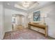 An open foyer with a wooden console table, elegant lamps, beautiful rug, and a striking chandelier, creating an inviting ambiance at 974 Cliffwood Dr, Mount Pleasant, SC 29464