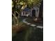 Charming front yard with a stone pathway leading to a well-lit home, creating a welcoming ambiance at 974 Cliffwood Dr, Mount Pleasant, SC 29464