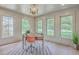 Bright home office with hardwood floors, neutral paint, many windows, and modern desk with decor at 974 Cliffwood Dr, Mount Pleasant, SC 29464