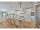 Bright kitchen features a large island with seating, pendant lights, and stainless steel appliances at 974 Cliffwood Dr, Mount Pleasant, SC 29464