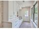 Charming mudroom features built-in storage, a bench, and decorative wallpaper at 974 Cliffwood Dr, Mount Pleasant, SC 29464