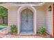 Charming outdoor shower with stone wall, detailed tile flooring, and lush greenery at 974 Cliffwood Dr, Mount Pleasant, SC 29464