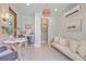 Pool house interior with mini fridge, couch, and marble-topped table, perfect for entertaining at 974 Cliffwood Dr, Mount Pleasant, SC 29464