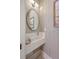 Modern powder room features checkerboard wallpaper, floating sink, and brushed nickel mirror at 974 Cliffwood Dr, Mount Pleasant, SC 29464