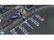 This aerial shows boats docked at a waterfront marina with nearby houses and clear water access at We 10Th St # A4, Folly Beach, SC 29439