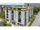 Multi-story building with a modern design and a yellow box showcasing a highlighted unit's location at 1 Cool Blow St # 153, Charleston, SC 29403