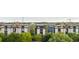 A complex of contemporary, multi-story apartments bordered by trees and a highway overpass at 1 Cool Blow St # 153, Charleston, SC 29403
