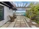Rooftop patio with decorative stone, wood pergola, and wicker rocking chairs at 1 Cool Blow St # 153, Charleston, SC 29403