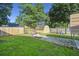 Fenced backyard featuring a storage shed, a paver patio, and lush lawn at 103 Case Ct, Ladson, SC 29456
