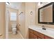 Bathroom with a wooden vanity, marble countertops, and tile flooring at 103 Case Ct, Ladson, SC 29456