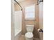 Cozy bathroom featuring a toilet, shower/tub combination, and a window with blinds at 103 Case Ct, Ladson, SC 29456