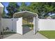 Car port featuring a large gate surrounding a concrete patio with covered parking at 103 Case Ct, Ladson, SC 29456