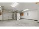 Large garage showcasing concrete flooring, two garage doors, and built in storage cabinets at 103 Case Ct, Ladson, SC 29456