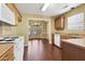 Cozy kitchen with wooden cabinets, white appliances, and access to the dining room at 103 Case Ct, Ladson, SC 29456