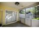 Enclosed porch with screened windows, offering views of the backyard and neighborhood at 103 Case Ct, Ladson, SC 29456