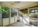 Enclosed porch with screened windows providing views of the backyard at 103 Case Ct, Ladson, SC 29456