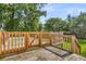 Wooden deck in the backyard is surrounded by a wooden safety rail at 105 Conductor Ct, Summerville, SC 29486