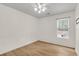 Bright bedroom with hardwood floors, ceiling fan, and a window bringing in natural light at 105 Conductor Ct, Summerville, SC 29486