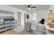 Bright bedroom features a ceiling fan, hardwood floors, a dresser, and a comfortable bed with decorative pillows at 105 Conductor Ct, Summerville, SC 29486