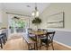 Cozy dining area with modern lighting and access to the outdoor patio through sliding glass doors at 105 Conductor Ct, Summerville, SC 29486