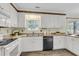Clean kitchen featuring white cabinets, modern appliances, and sink with a window view at 105 Conductor Ct, Summerville, SC 29486