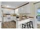 Efficient white kitchen with breakfast bar, ample cabinet space, and modern appliances at 105 Conductor Ct, Summerville, SC 29486