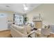 Cozy living room featuring hardwood floors, natural light, and comfortable white sofa at 105 Conductor Ct, Summerville, SC 29486