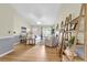 Open living room boasts hardwood floors, neutral tones, and stylish ladder shelving at 105 Conductor Ct, Summerville, SC 29486