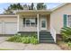 Charming front porch with green shutters and landscaping creates a welcoming entrance at 105 Conductor Ct, Summerville, SC 29486