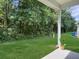 Covered back patio overlooking a spacious backyard surrounded by mature trees at 1069 Lexi Ct, Ladson, SC 29456