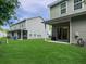 Well maintained backyard with lush green grass and a covered patio area at 1069 Lexi Ct, Ladson, SC 29456