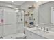 Bright bathroom featuring a glass shower, floating shelves, and a marble vanity at 1069 Lexi Ct, Ladson, SC 29456