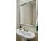 Updated bathroom featuring a pedestal sink, modern faucet, and a framed mirror at 1069 Lexi Ct, Ladson, SC 29456