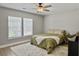 Cozy bedroom features a ceiling fan, a patterned rug, and a sunlit window at 1069 Lexi Ct, Ladson, SC 29456