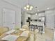 Well-lit dining area adjacent to the kitchen, complete with stylish bar stools and tiled floor at 1069 Lexi Ct, Ladson, SC 29456