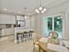 Dining area boasts a round table, barstools, and a sliding door leading to the outdoors at 1069 Lexi Ct, Ladson, SC 29456