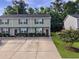 Traditional style home with driveway and a neatly landscaped front yard at 1069 Lexi Ct, Ladson, SC 29456
