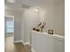 Upstairs hallway adorned with flowers and Gathering photos at 1069 Lexi Ct, Ladson, SC 29456