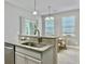 Kitchen with granite countertops and stainless steel sink, complemented by sliding glass doors at 1069 Lexi Ct, Ladson, SC 29456