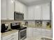 Bright kitchen featuring white cabinets, stainless steel appliances, and granite counters at 1069 Lexi Ct, Ladson, SC 29456