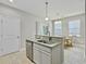 Bright kitchen featuring granite counters, stainless steel dishwasher and an island with a sink and an eat-in breakfast bar at 1069 Lexi Ct, Ladson, SC 29456