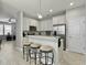 Open kitchen showcases stainless steel appliances, granite countertops, and a breakfast bar with seating at 1069 Lexi Ct, Ladson, SC 29456