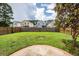 A level and green backyard with a wood fence surrounding the property at 107 Brookhaven Rd, Summerville, SC 29486
