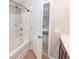 This is a bathroom with a shower/tub combo and view into the adjacent bedroom at 107 Brookhaven Rd, Summerville, SC 29486