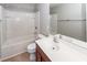 A clean, bright bathroom with a tub and a single sink vanity and white tiled walls at 107 Brookhaven Rd, Summerville, SC 29486