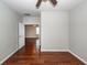 Inviting bedroom with wood floors, a ceiling fan, and an open doorway leading to another room at 107 Brookhaven Rd, Summerville, SC 29486