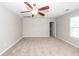 This is a spacious bedroom with neutral walls, carpet, a ceiling fan, and natural light at 107 Brookhaven Rd, Summerville, SC 29486