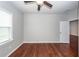 Comfortable bedroom with wood floors and a ceiling fan, with natural light creating a serene retreat at 107 Brookhaven Rd, Summerville, SC 29486