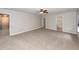 This bedroom features neutral walls, carpet, a ceiling fan, and two doors on the right at 107 Brookhaven Rd, Summerville, SC 29486