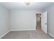 Bedroom features neutral paint and carpet with overhead lighting and access to another room at 107 Brookhaven Rd, Summerville, SC 29486